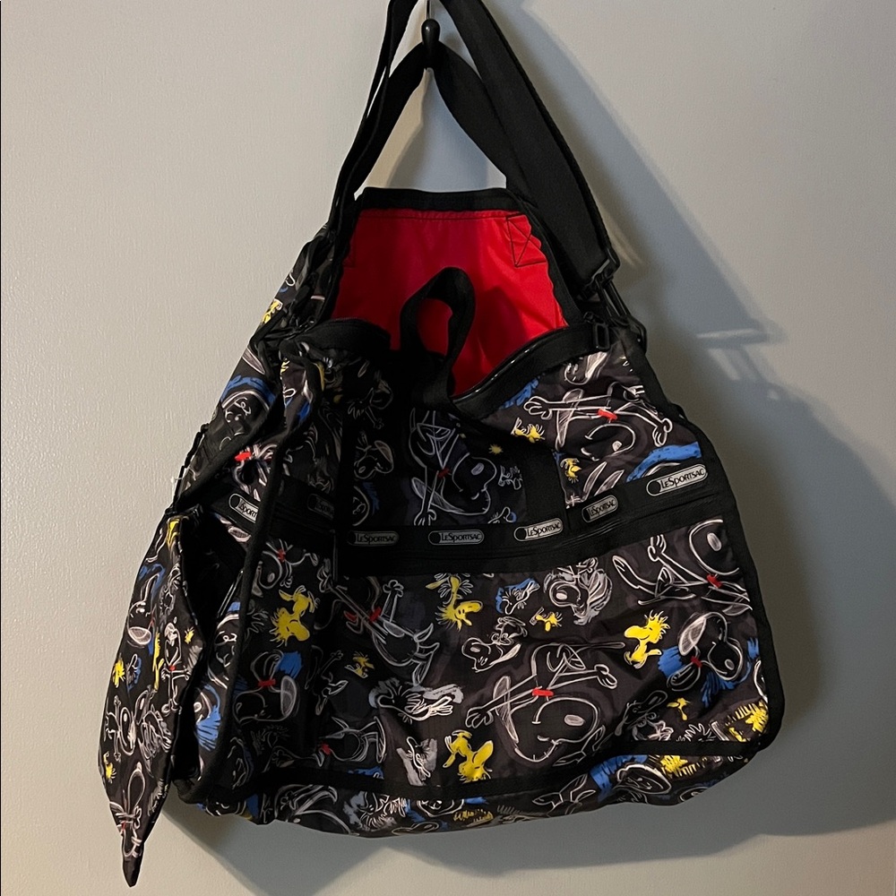 Lesportsac Black Duffel Bag in Chalkboard Snoopy Pattern.